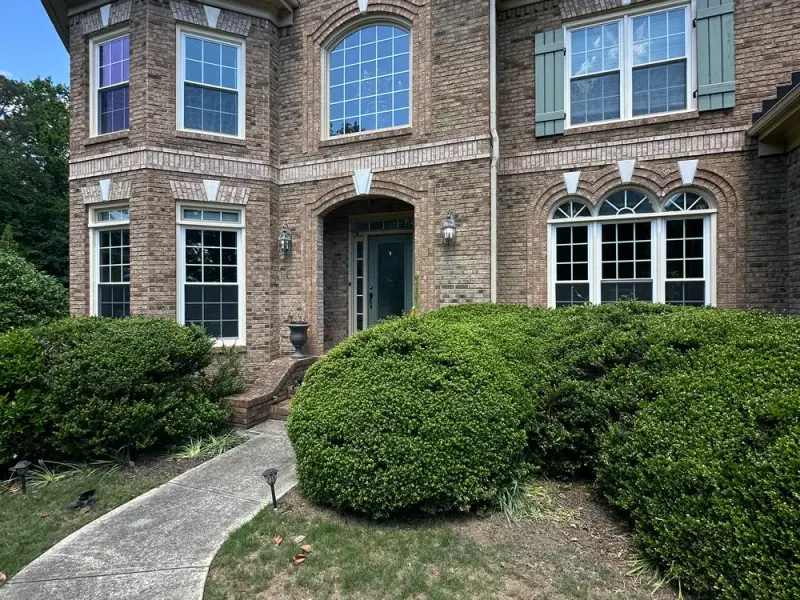 Front elevation after new white replacement windows were installed